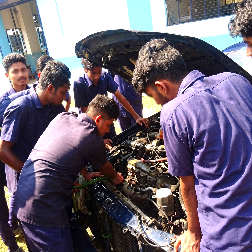 Mechanic hands working on a vehicle engine in a professional workshop